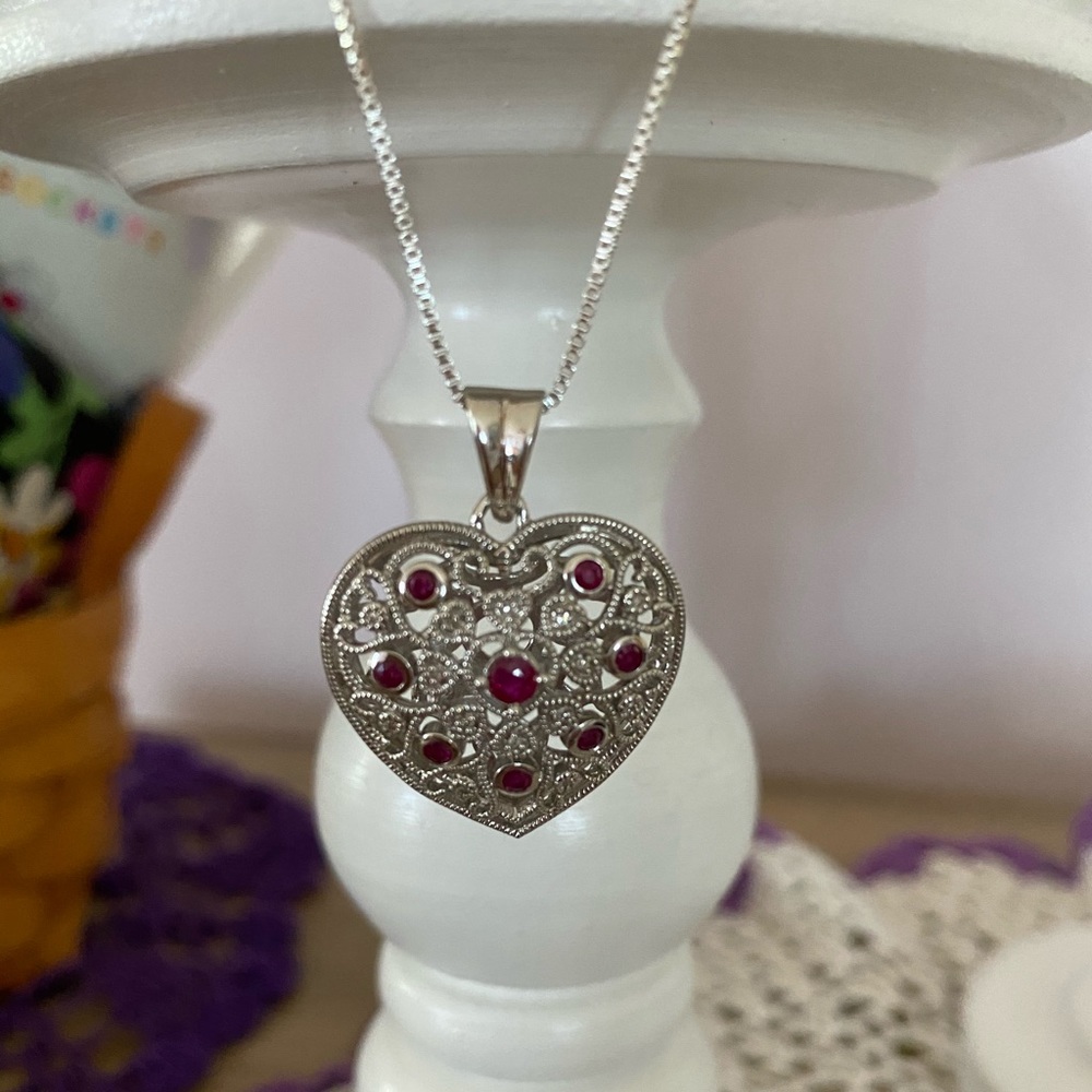 925 18” chain with a ruby and diamond pendant.